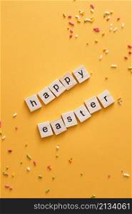 top view happy easter greeting made out scrabble