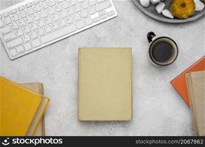 top view hardback books desk with coffee keyboard