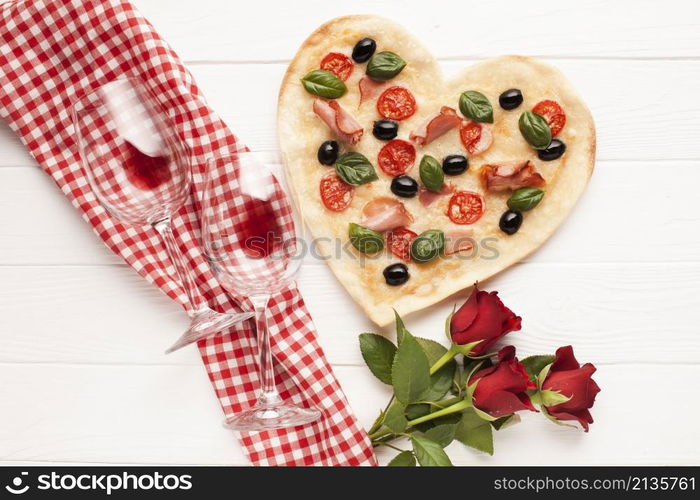 top view heart shaped pizza with wine