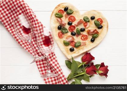 top view heart shaped pizza with wine
