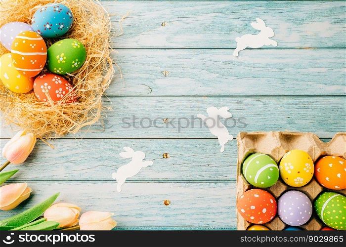 Top view holiday banner background web design white easter eggs in brown nest on blue wooden background with empty copy space, celebration greeting card, overhead, template, Happy Easter Day Concept