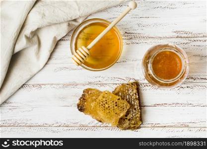 top view honey jars with honeycomb. Resolution and high quality beautiful photo. top view honey jars with honeycomb. High quality beautiful photo concept