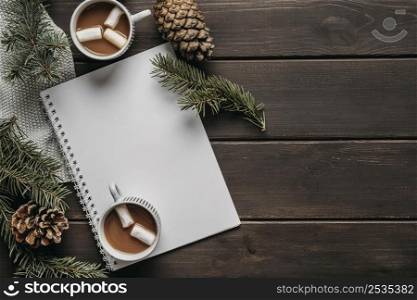 top view hot chocolate cups with blank notebook copy space