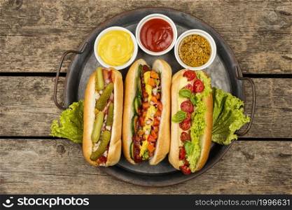 top view hot dogs with sauce plate