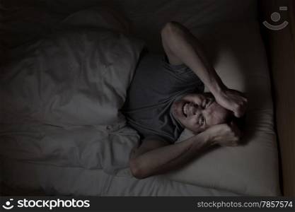 Top view image of mature man showing anger from insomnia