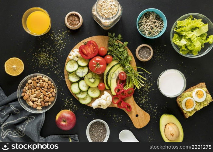 top view ingredients dryfruits vegetables black background