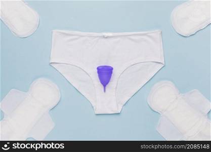 top view knickers with menstrual cup sanitary towels