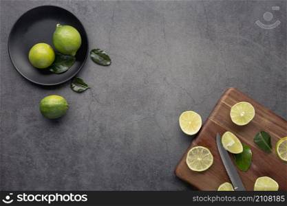 top view limes lemons with leaves