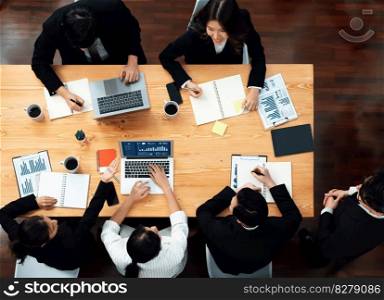 Top view manager or office worker give presentation in harmony conference room to business colleague, BI data dashboard on screen and pile of financial analyzed data reports on meeting table.. Top view business presentation at harmony conference room with colleagues.