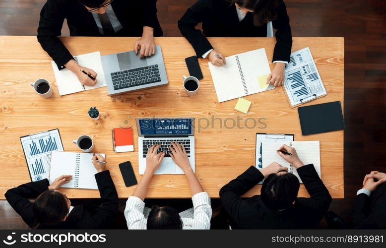 Top view manager or office worker give presentation in harmony conference room to business colleague, BI data dashboard on screen and pile of financial analyzed data reports on meeting table.. Top view business presentation at harmony conference room with colleagues.