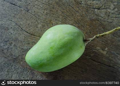 top view mango fruit on a wooden background. green mango