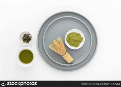 top view matcha powder with bamboo whisk