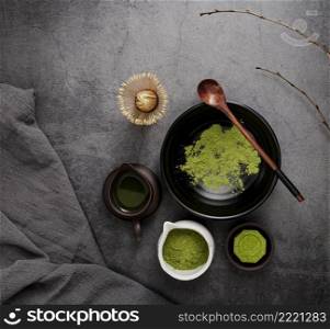 top view matcha tea with branches wooden spoon