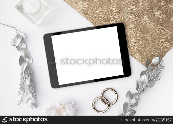 top view mock up tablet with wedding rings