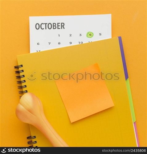 top view notebook with bone calendar animal day