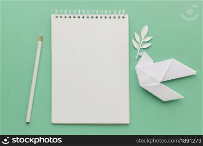 top view notebook with paper dove pencil. Resolution and high quality beautiful photo. top view notebook with paper dove pencil. High quality and resolution beautiful photo concept