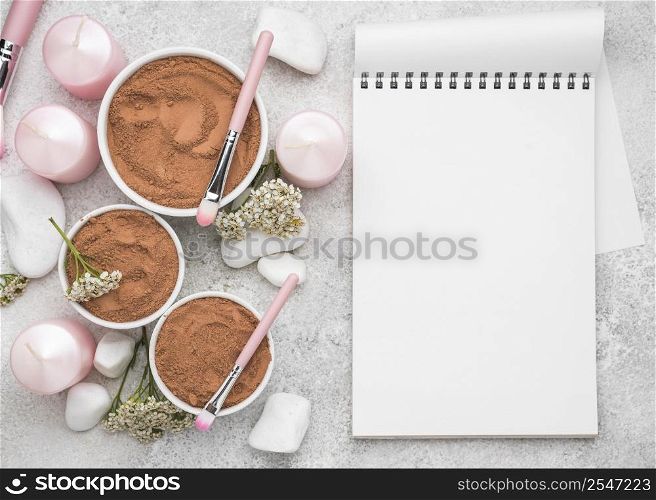 top view notebook with powder bowls brushes
