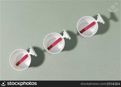 top view oblique line plastic cups razor blades