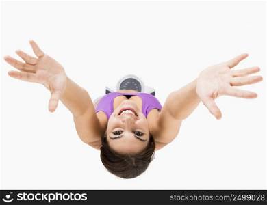 Top view of a beautiful athletic woman with arms up, isolated on white