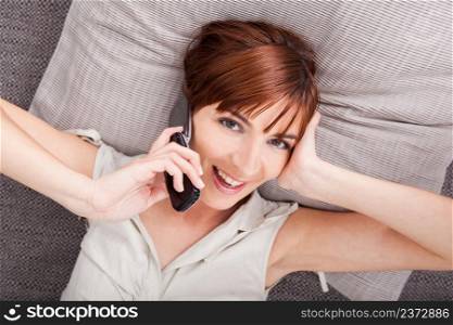 Top view of a beautiful woman talking on phone