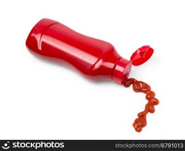 Top view of a bottle of ketchup a small blob squeezed out onto a white background.with clipping path