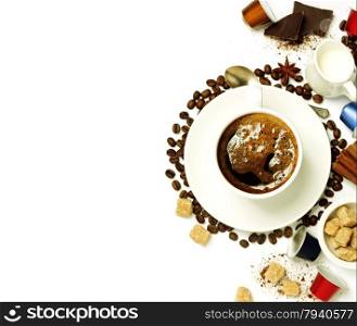 Top view of a cup of coffee with coffee beans, sugar, milk and capsules