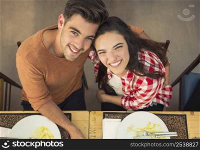 Top view of a young couple at the restaurant having a good time