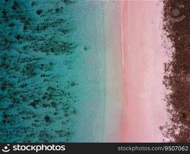 Top view of blue ocean with pink sandy beach at at Labuan Bajo Indonesia