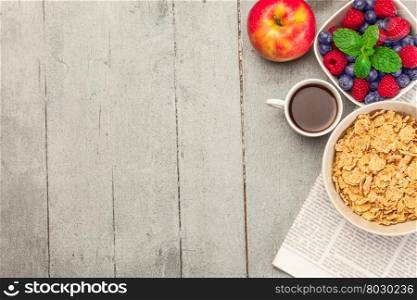 Top view of breakfast meal over wooden table