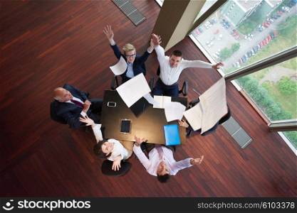 top view of business people group on meeting throwing documents in air