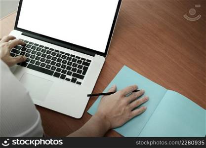 top view of businessman hand working with new modern computer and smart phone and business strategy on wooden desk with social media network as concept  