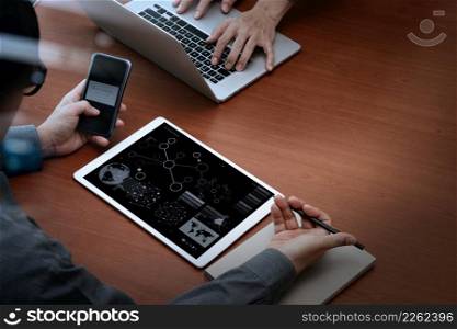 "top view of businessman hands using digital pro tablet and smart phone with "Secure payment" on the screen as Online shopping concept"