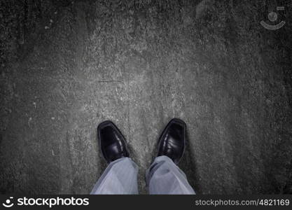 Top view of businessman legs choosing his way. Find your own way