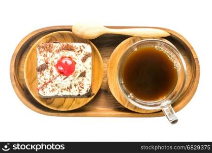 Top view of chocolate cake and a cup of coffee in wooden plate on white background