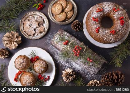 top view of christmas desserts with red berries and pine cones. Resolution and high quality beautiful photo. top view of christmas desserts with red berries and pine cones. High quality and resolution beautiful photo concept
