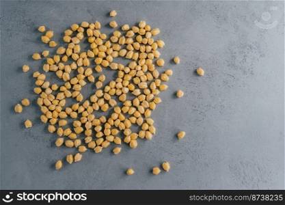 Top view of clean fresh garbanzo or chickpeas on grey background. Flat lay. Raw food for vegans. Close up. Ingredients full of protein