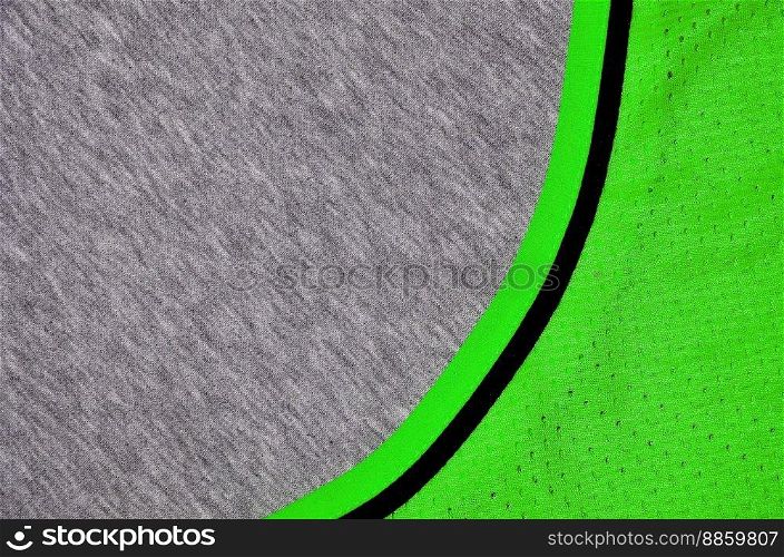 Top view of cloth textile surface. Close-up rumpled heater and knitted fabric texture with a thin striped pattern. Sport clothing fabric texture. Colored basketball shirt and heater hoodie