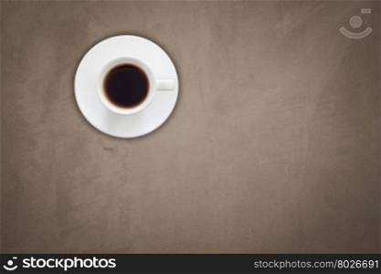 Top view of coffee cup on gray concrete texture background