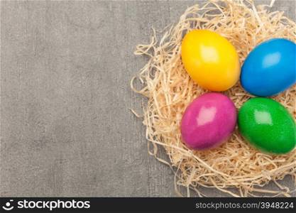 Top view of colorful easter eggs over wooden table