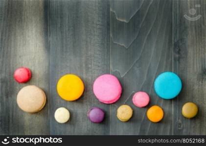 top view of colorful macaroons . top view of colorful macaroons on a wooden background