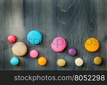 top view of colorful macaroons . top view of colorful macaroons on a wooden background