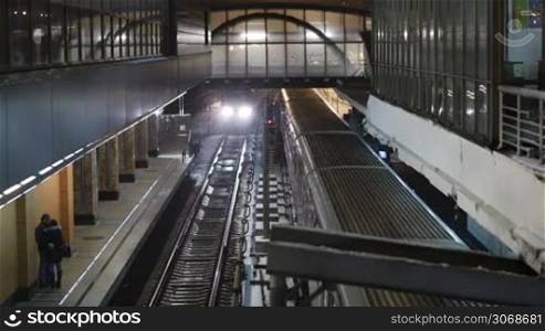 Top view of coming and leaving trains at Kuntsevskaya metro station in Moscow, Russia