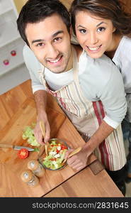 Top-view of couple making salad