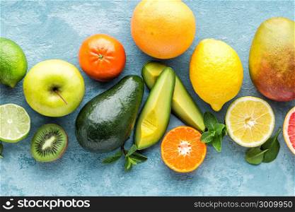 top view of different selected juicy organic tropical fruits, superfood, healthy food background