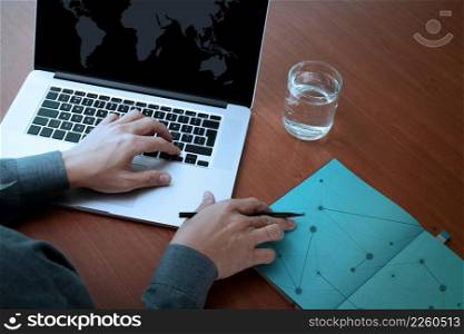 top view of Double exposure of businessman hand working with new modern computer and business strategy and social media diagram as concept