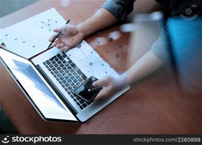 top view of Double exposure of businessman hand working with new modern computer and business strategy as concept