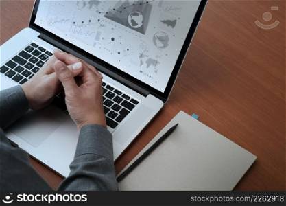 top view of Double exposure of businessman hand working with new modern computer and business strategy and blank book as concept