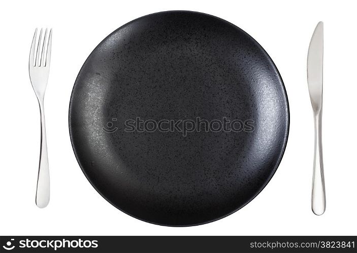 top view of empty black dinner plate with fork and knife isolated on white background