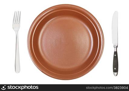 top view of empty brown ceramic dinner plate with fork and knife isolated on white background