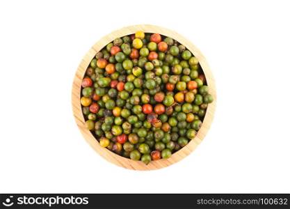 top view of fresh peppercorns in wooden bowl on white background